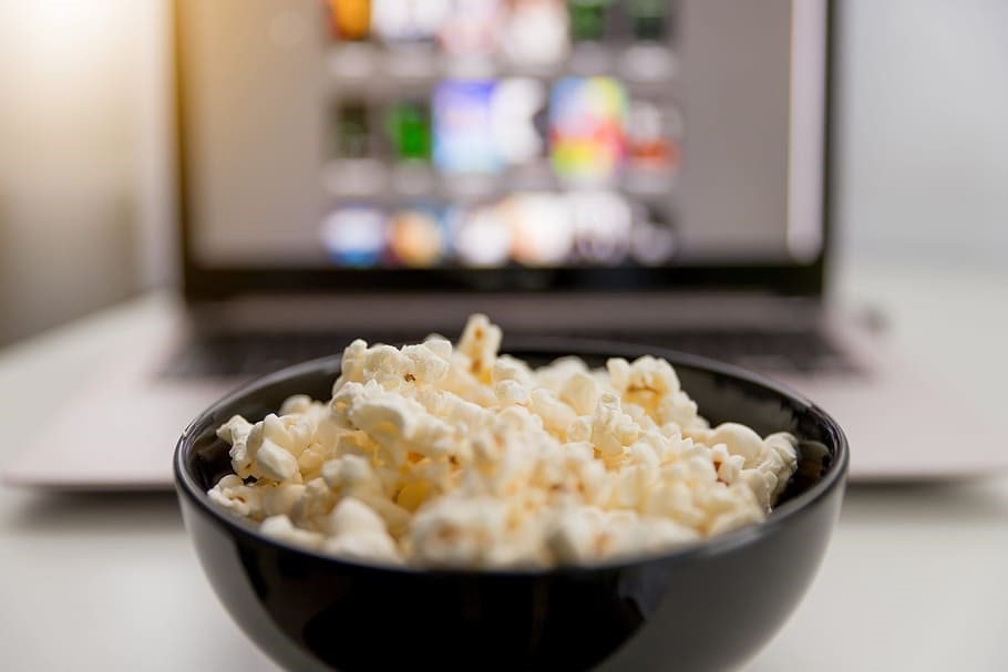 Popcorn-in-front-of-a-laptop-with-movie-selections