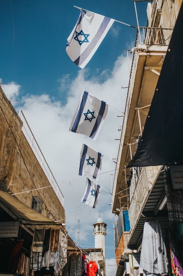 A building decorated with flags of Israel