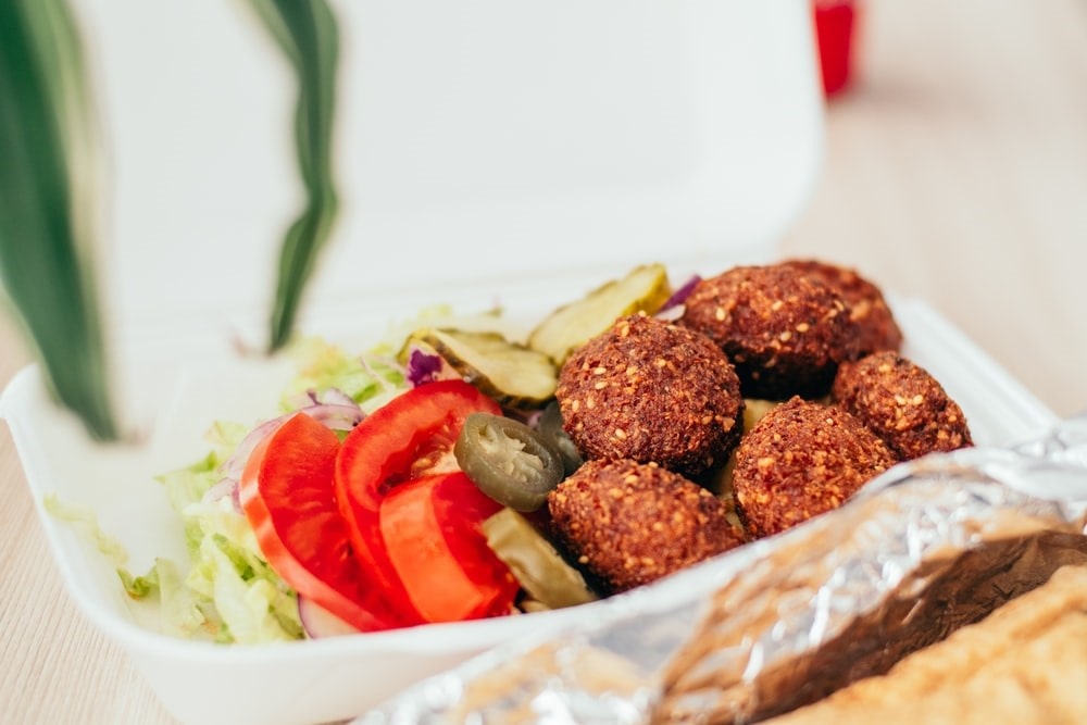 A delicious falafel platter topped with jalapenos