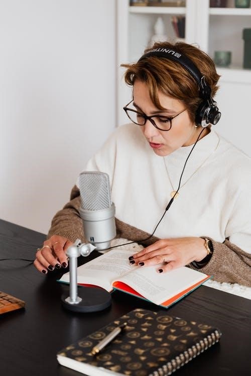 Woman recording voice while reading a book