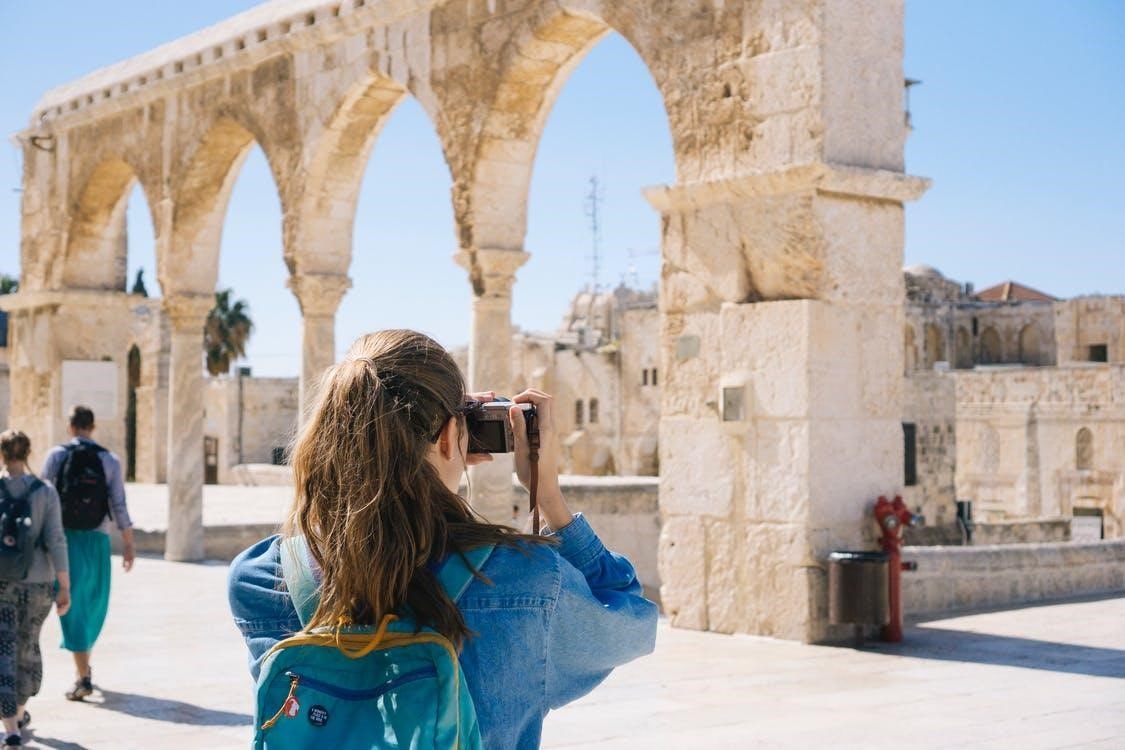 woman taking pictures in Israel