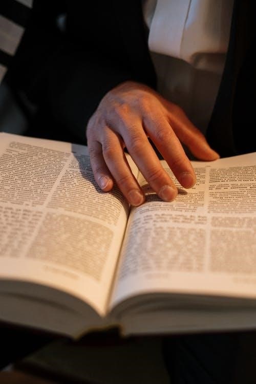 a person reading Hebrew